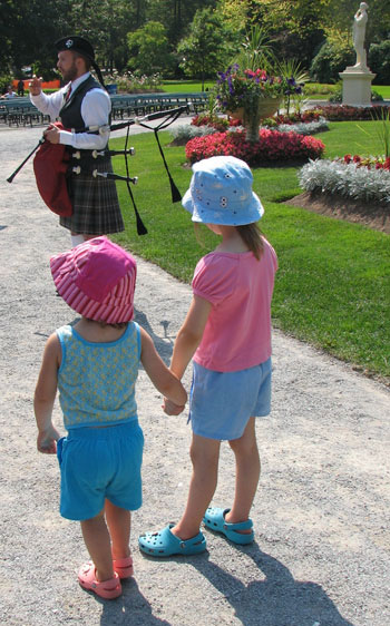 Children watch piper in Halifax Public Gardens.  Photo by Margaret Deefholts