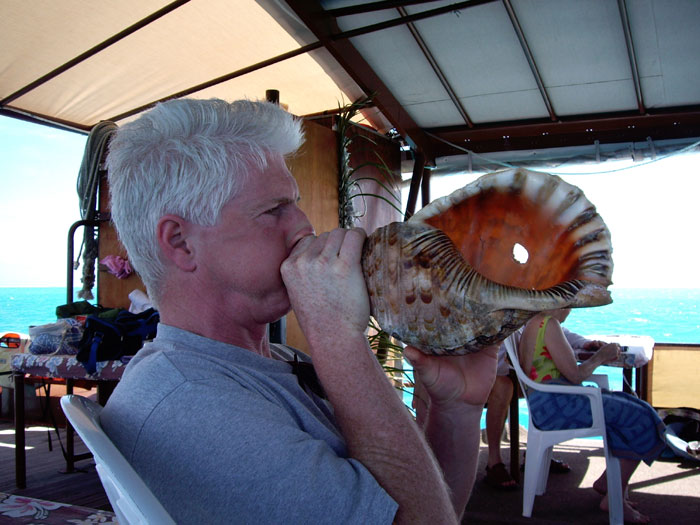 Brent trying out the conche call during the trip to One Foot Island.