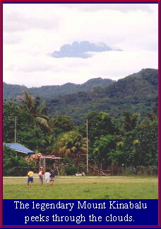 Sabah's Mt. Kinabalu peeks through the clouds