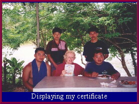 Maxine George proudly displays her certificate after white water rafting in Malaysia's Sabah