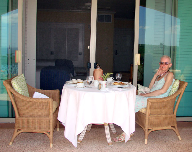 Cathy having breakfast on patio at the Four Season's Resort Lanai. Photo by M. Maxine George