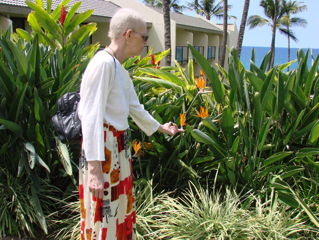 Cathy McDonald enjoying garden at Wailea Beach Resort, Maui. Photo by M. Maxine George