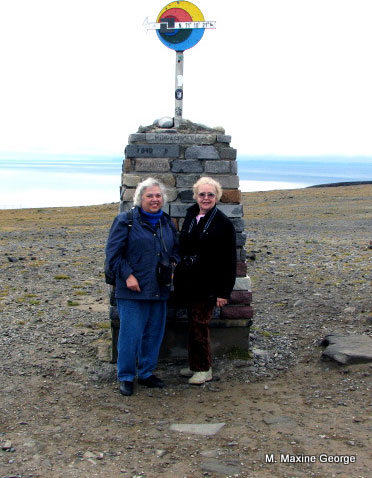 Points direction to northernmost point in Europe on promontory at Nordkapp or North Cape, Norway