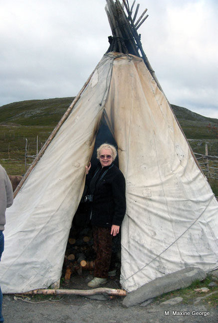 Maxine looks in Laplander's tepee