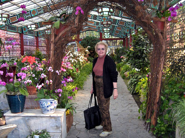 Maxine in floral conservatory in Chaing Kai Shek's park-like grounds.