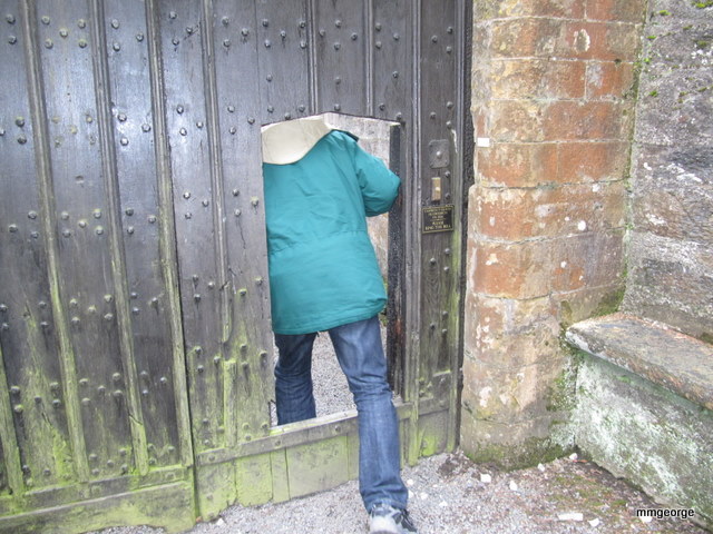 Stepping through the small door in the old gate at Gwydir Castle, Wales.   Photo by M. Maxine George