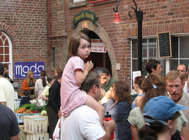 A little girl takes in the scene at the Saturaday Framer's Market in Halifax, Nova Scotia. Photo by Margaret Deefholts