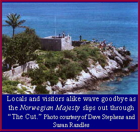Locals and visitors alike wave goodbye as the Norwegian Majesty slips out through "The Cut."