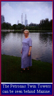 The Petronas Twin Towers can be seen behind Maxine.