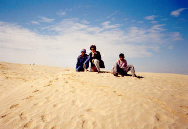 Barbara and the boys on a sand dune