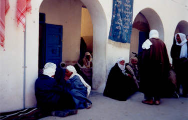Tunisian men gather in the street