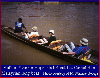 Malaysian long boat with author aboard.