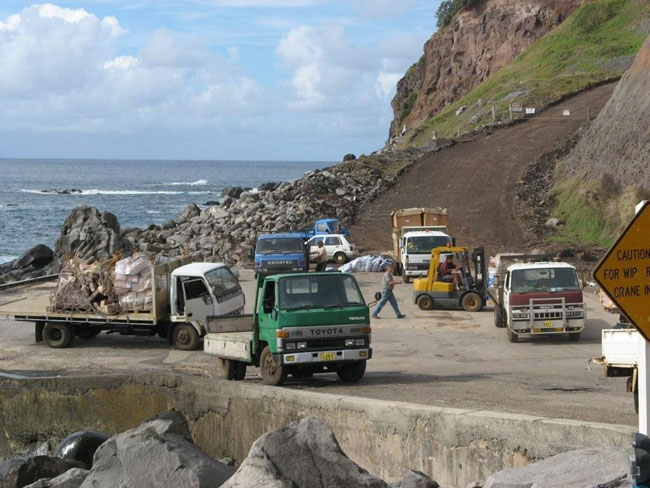 Trucks on wharf, Norfolk Island.      Picture courtesy of Barry and Heather Minton