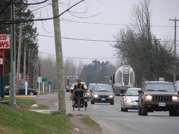Randolph Westphal  and dogs on Fraser Highway coming into Aldergrove, B.C.