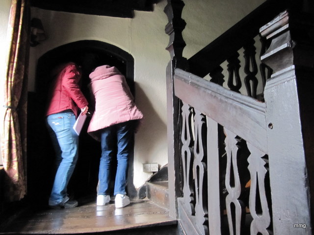  Canadian gals stop on the landing to peer into the small room used to incarcerate prisioners at the Skirrid Mountain Inn, Wales.  Photo by M. Maxine George