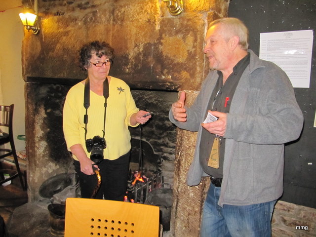 Sandra Phinney listen attentively as Neil Bell tells about the history of the Queens Head Hotel, Monmouth, Wales.    Photo by M. Maxine George